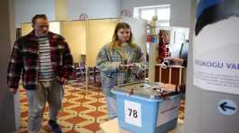 People cast their ballots at a poling station