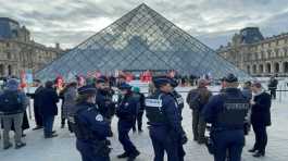 protesters holding French CGT labour union flags