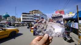 Iraqi men clearing then rubble 