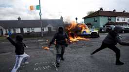 petrol bombs at a police car