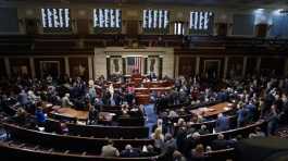 Kevin McCarthy stands center in the House Chamber