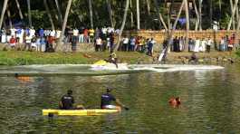 Rescuers on a boat search after a tourist boat capsized