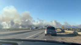 Smoke rises from a wildfire