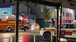 Fire fighters outside the Loafers Lodge hostel in New Zealand