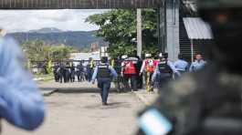 Police officers guard entrance to the womens prison in Tamara