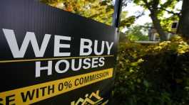 A sign is seen near a home being remodeled