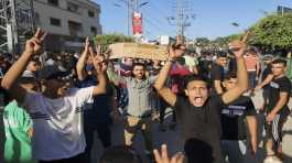 palestinian demonstrators chant slogans during a protest