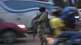 soldier monitors vehicle traffic