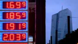 Gas prices are displayed at a gas station