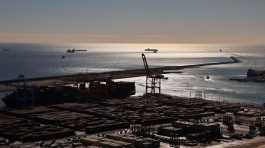 Shipping containers move at the port of Barcelona