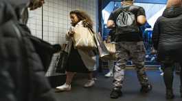 woman holding several shopping bags