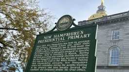 marker stands outside the Statehouse